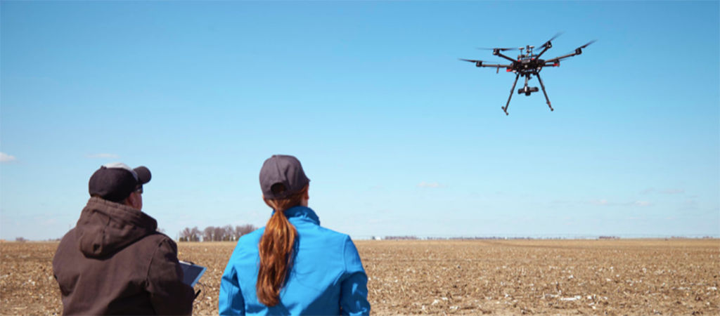 farmers driving drone